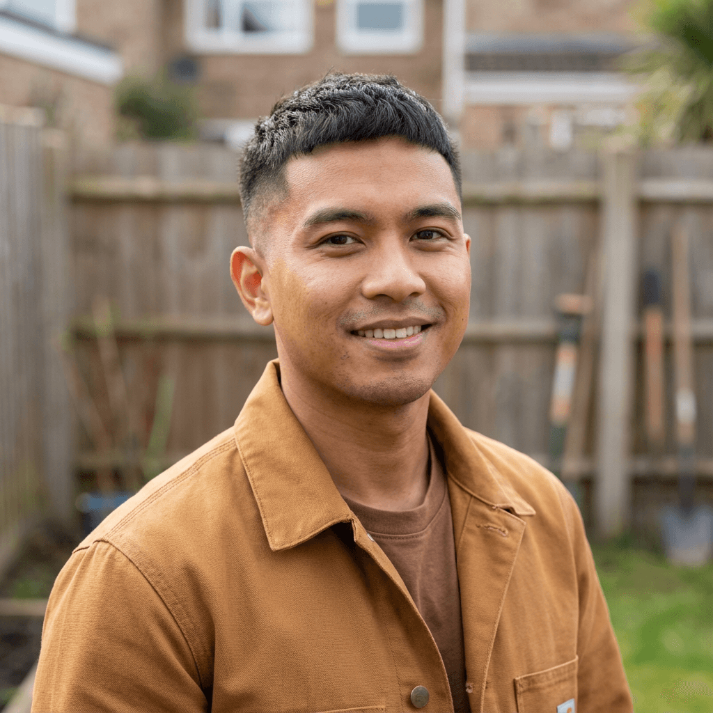 Marcus Chen standing in his tidy living room